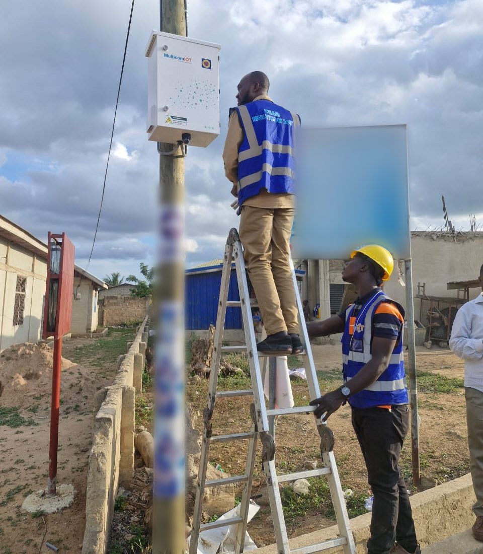 A monitoring unit being installed on a pole